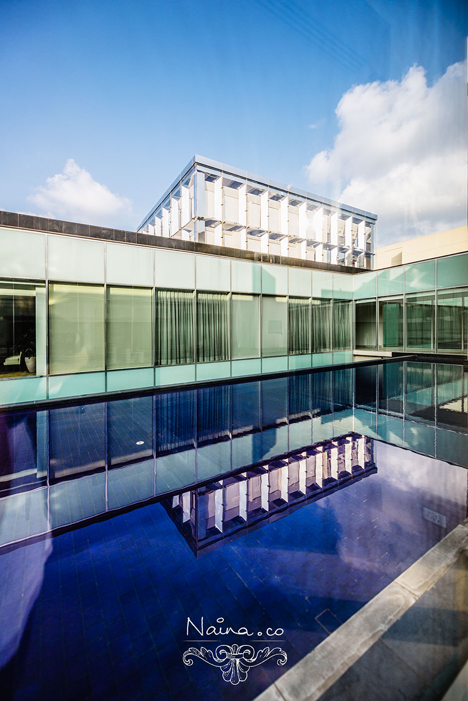 The Oberoi Hotel, Gurgaon. Blue tiles, water and blue skies. Photography by photographer Naina Redhu of Naina.co