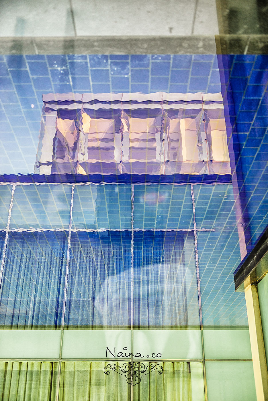 The Oberoi Hotel, Gurgaon. Blue tiles, water and blue skies. Photography by photographer Naina Redhu of Naina.co