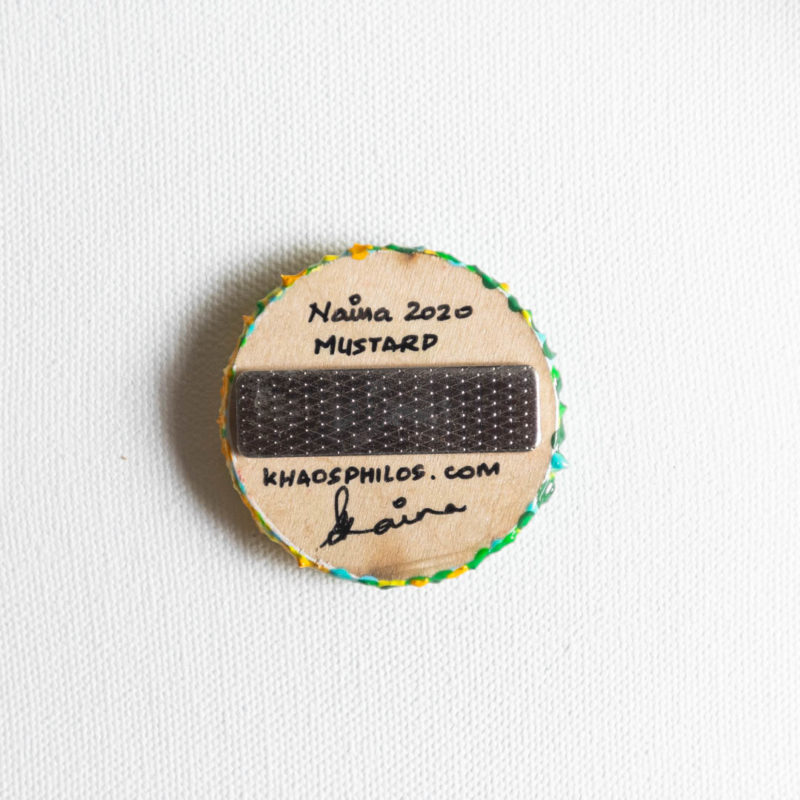 indian contemporary artist, indian contemporary painter, contemporary artist india, abstract art, khaosphilos, hand painted, wearable art, display art, original art, contemporary art, contemporary artist, naina redhu, naina.co, 2 inches diameter, 2 inch, circular canvas, acrylics on wood, wooden brooch, brooch, art brooch, wearable art brooch, wearable art jewellery, canvas display, magnet clasp, acrylic painting, khaos philos, chaos lover, impressionist, impressionism, green, yellow, mustard, mustard flowers, mustard field, haryana, punjab